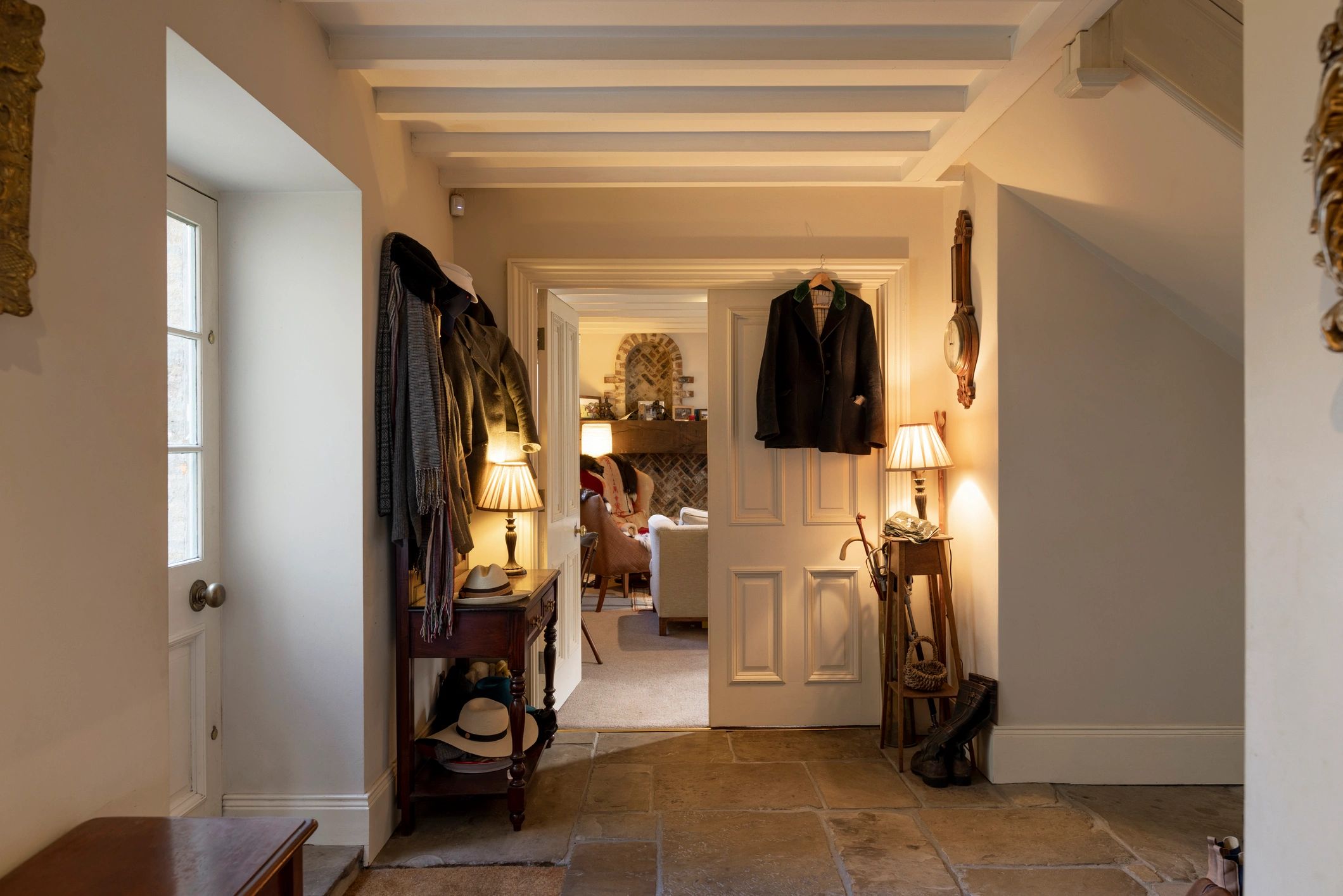 Warm luxury custom home interior with refined entrance hall details