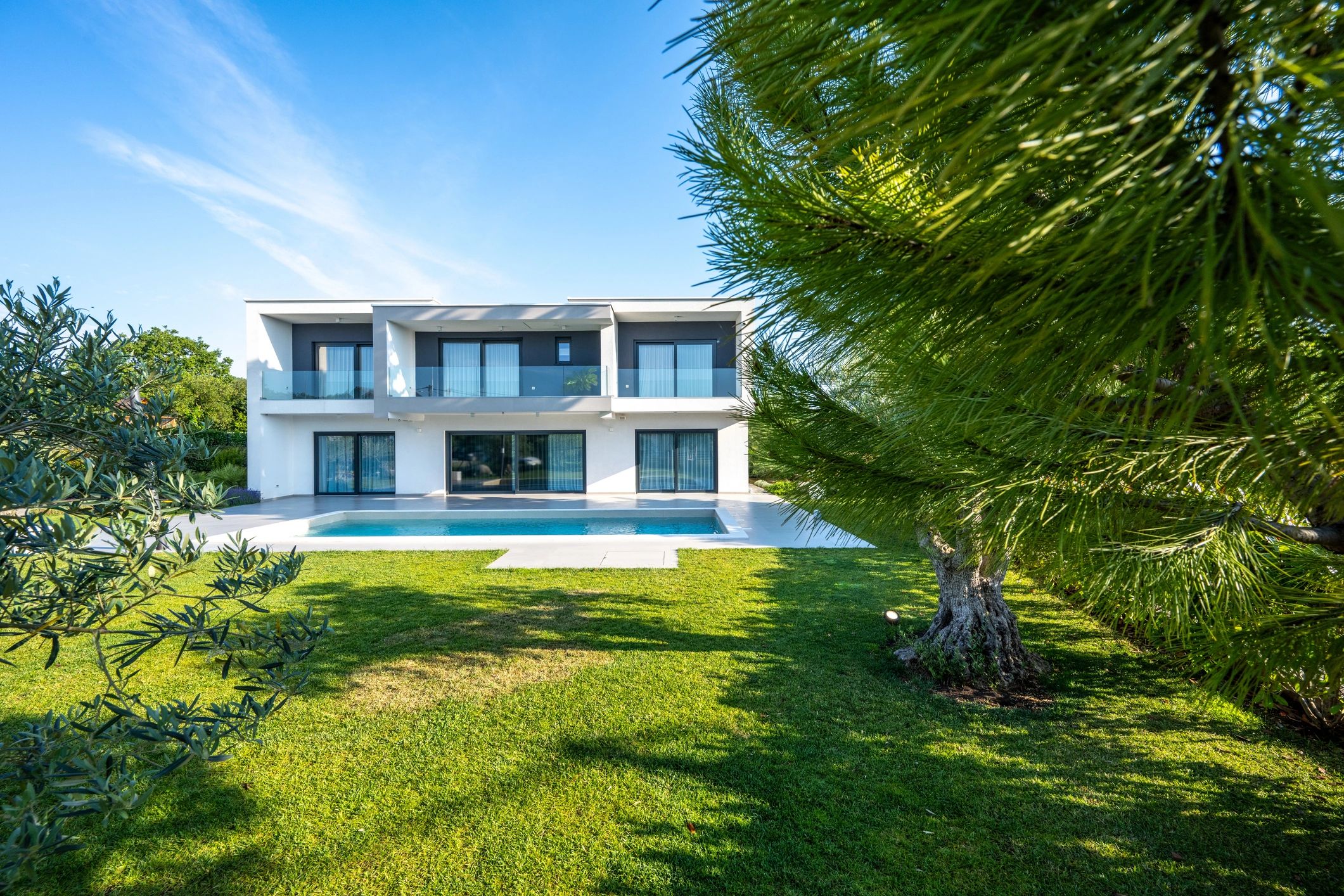 Luxury custom home exterior with modern architecture and pool